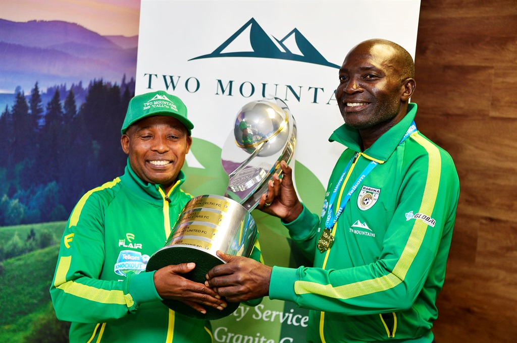 Baroka FC coach Wedson Nyirenda handing over a trophy to two- mountain chairman Freddy Masekwameng at the Two Mountain offices if Parktown, Johannesburg.Picture: Lucky Morajane