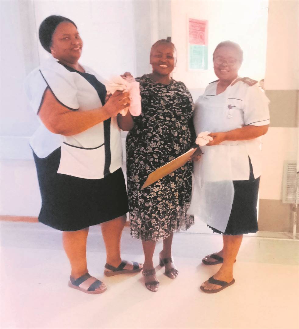 Talitha Leqheku (middle) of Free State Care in Action in Kroonstad during the visit to the Boitumelo Regional Hospital to donate knitted beanies and socks for babies. With her are Sister Pinki Mokotedi (left) and Sister Hilda Kgopane.   Photo: Supplied