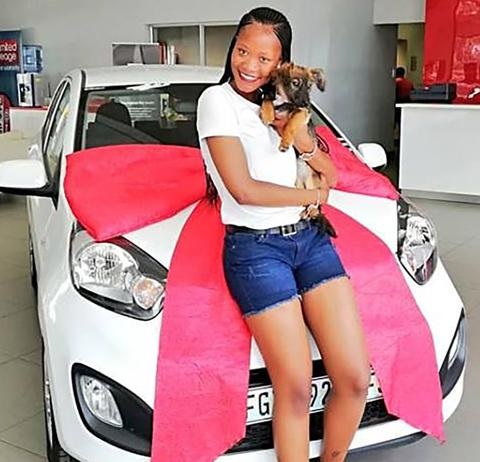 Skolopad’s daughter, Amzozo Qwabe (18), with the new car her mother bought her.