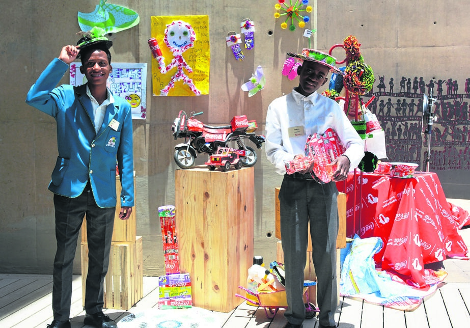 From left: Tebogo Petje and Njabulo Monareng with some of the toys and artwork they have created using recyclable material.                                     Photo by Morapedi Mashashe