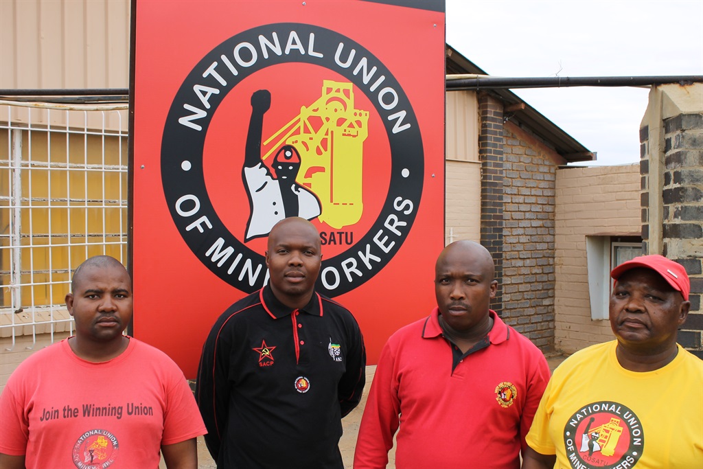 Suspended NUM branch secretary at South Deep Thulani Mashibini, wearing the black shirt, with other NUM members on strike at the South Deep mine. Picture: Supplied
