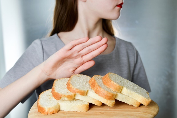 Gluten intolerance concept. Young girl refuses to 