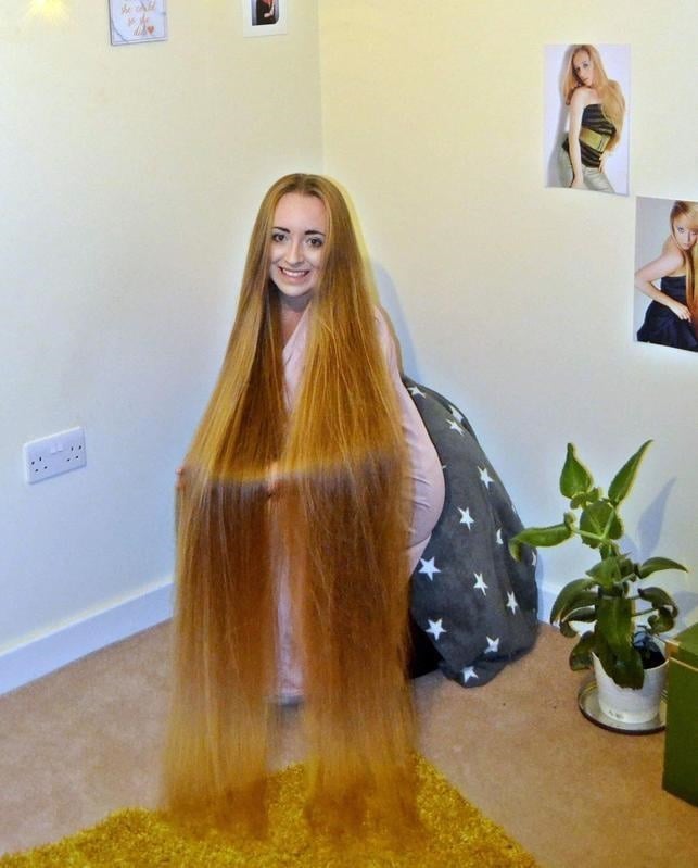 Woman who's never cut her  hair insists her Rapunzel-length locks make  her irresistible to men | Life