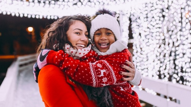 A mother and son enjoy their first White Christmas together