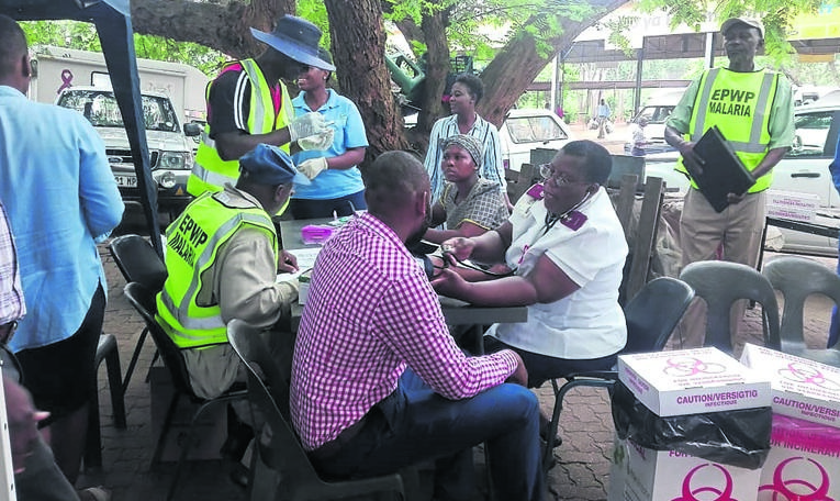 Taxi drivers and hawkers learn about the value of being tested for various diseases.          Photo by Cleopatra Makhaga
