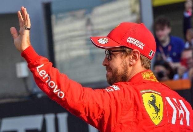 Ferrari's German driver Sebastian Vettel waves at the Yas Marina Circuit in Abu Dhabi, ahead of the final race of the Formula One Grand Prix season, on December 1, 2019. GIUSEPPE CACACE / AFP