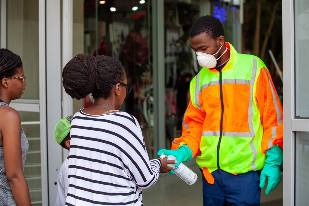 People sanitising hands at Maponya Mall as a measure to help curb the spread of the Covid-19 outbreak. (Papi Morake, Gallo Images)