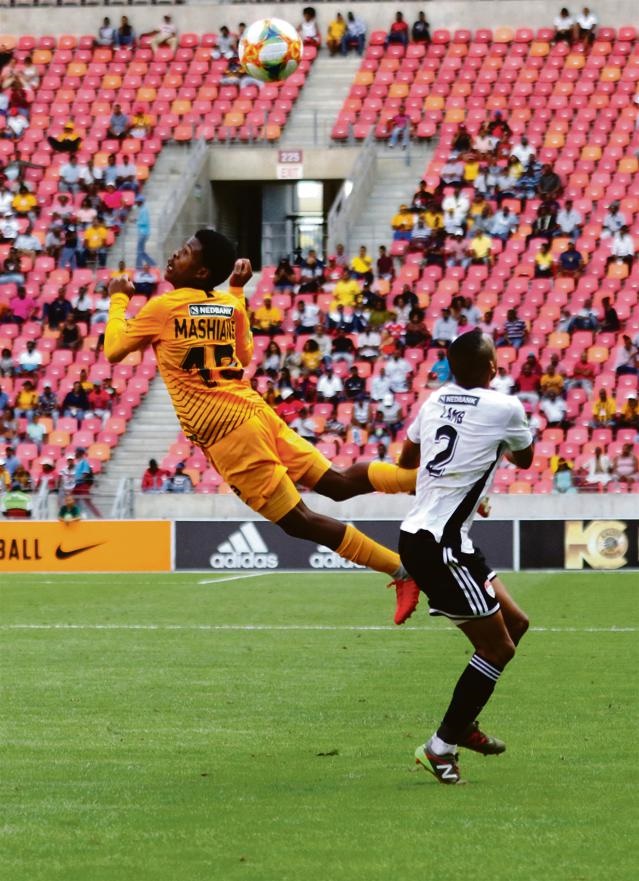 Happy Mashiane of Kaizer Chiefs and Magic FC's Dante Lamb fight for an aerial ball.
Photo: Richard Huggard/Gallo Images
