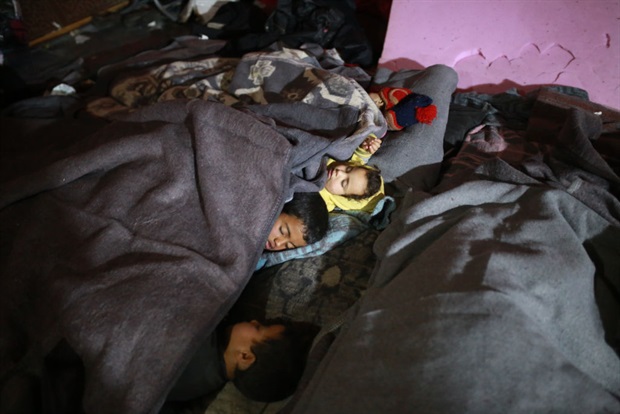 <p>Children sleep as earthquake survivors live in a tent in an amusement park which has turned into a shelter for earthquake victims in Idlib, Syria on 13 February 2023.<em></em></p><p><em>(PHOTO: Muhammed Said/Anadolu Agency via Getty Images)</em></p>