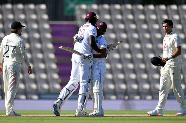 West Indies captain Jason Holder celebrates with John Campbell (Getty).