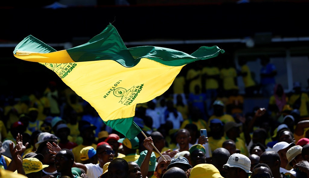 PRETORIA, SOUTH AFRICA - MARCH 11: Mamelodi Sundowns supporters waving a flag during the CAF Champions League match between Mamelodi Sundowns and Al Ahly at Loftus Versfeld on March 11, 2023 in Pretoria, South Africa. (Photo by Gallo Images)