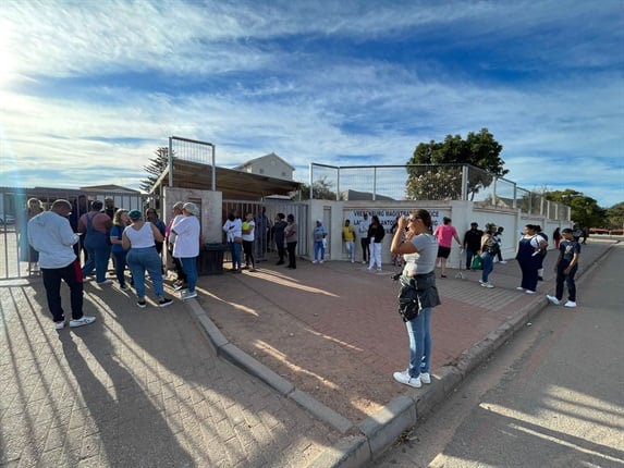 <p>A
small crowd gathered outside Vredenburg Magistrate's Court on Monday morning in
anticipation of the latest accused in the Joshlin Smith case. </p><p><em>(Photo by Chelsea
Ogilvie/News24)</em></p>