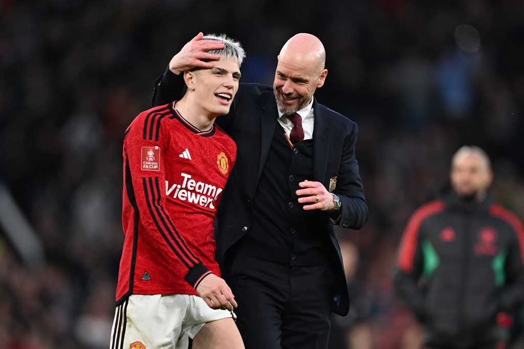 Alejandro Garnacho is embraced by Erik ten Hag, manager of Manchester United, after the Emirates FA Cup quarter-final victory against Liverpool at Old Trafford on 17 March 2024 in Manchester, England. (Michael Regan/Getty Images)