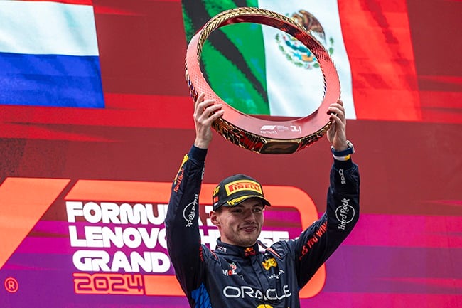 Max Verstappen celebrates on the podium after winning the Chinese Grand Prix at Shanghai International Circuit on 21 April 2024. (Edmund So/Eurasia Sport Images/Getty Images)