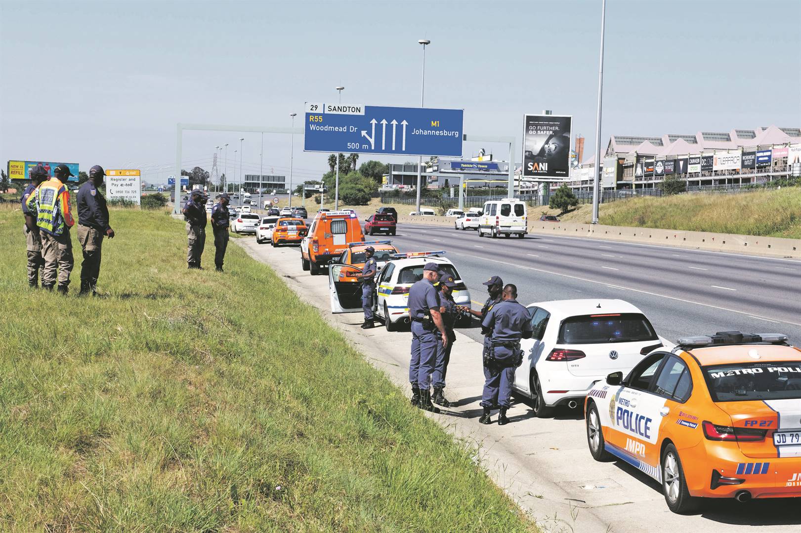 Police gather on a highway in Johannesburg yesterday to prepare for the shutdown.