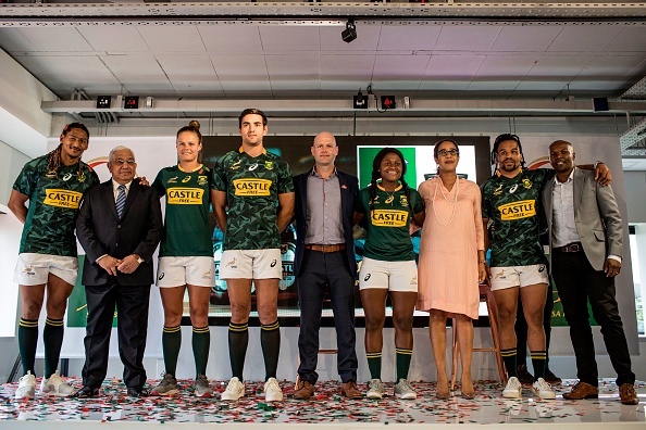 (L-R) South African National Springbok Sevens players Justin Geduld, President of SA Rugby Mark Alexander, Springbok Sevens players Marithy Pienaar and Chris Dry, Brand Director of South African Breweries (SAB) Vaughn Croeser, Springbok Sevens player Zintle Mpupha, Vice President of Marketing of SAB Andrea Quaye, Springbok Sevens player Rosko Specman and Sponsorship Manager of SAB Malefetsane Mbele pose following the announcement of a new sponsorship by South African Breweries (SAB) for the National Springbok Sevens and Springbok Women's Sevens teams on February 28, in Johannesburg.  / AFP PHOTO / GULSHAN KHAN        (Photo credit should read GULSHAN KHAN/AFP/Getty Images)