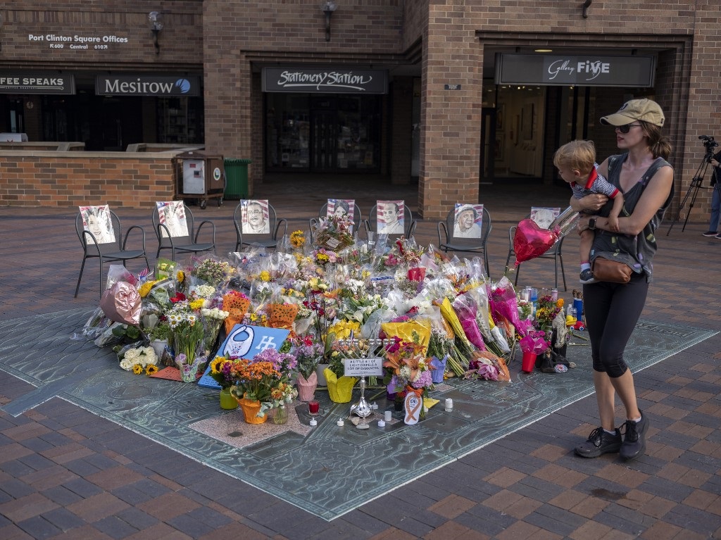 A make-shift memorial in the city centre near where police say accused shooter Robert “Bobby” E. Crimo III opened fire on a crowd during a Fourth of July parade. 