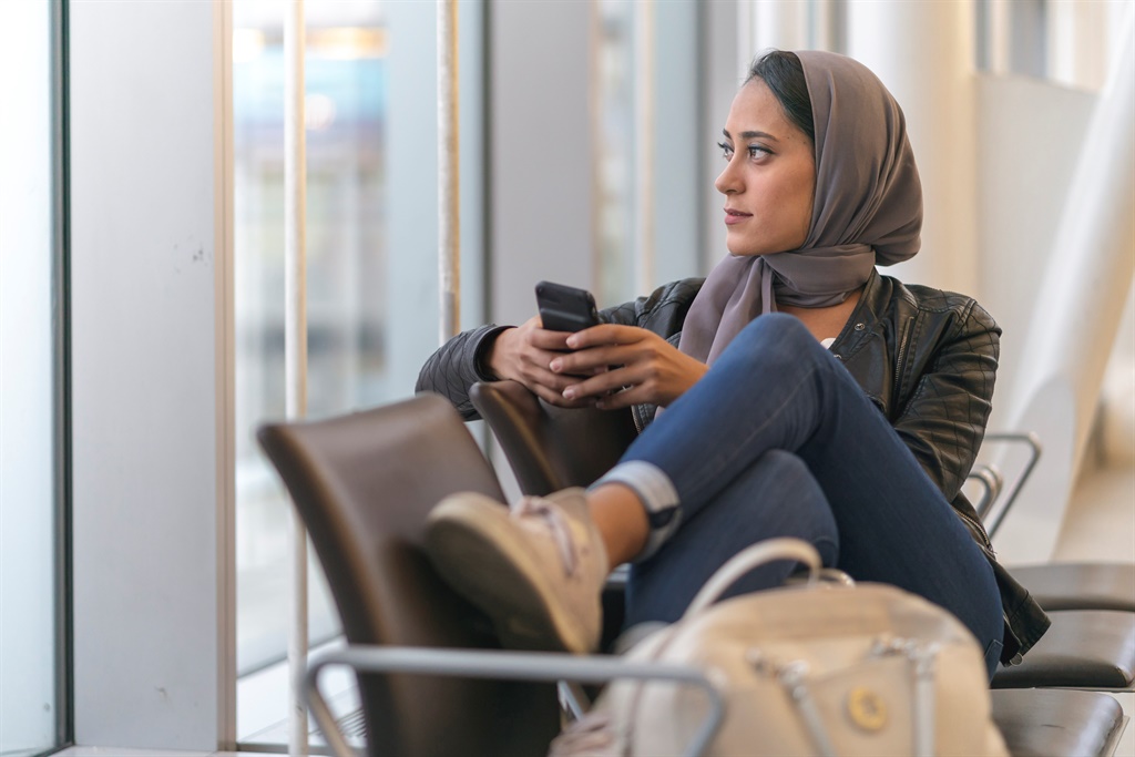 Muslim woman holding phone