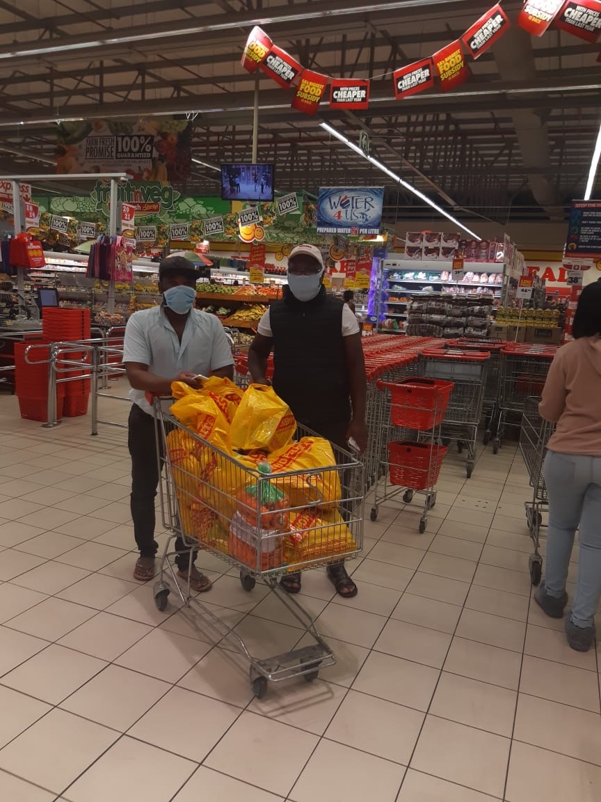 Volunteers buying supplies for the soup kitchen (s