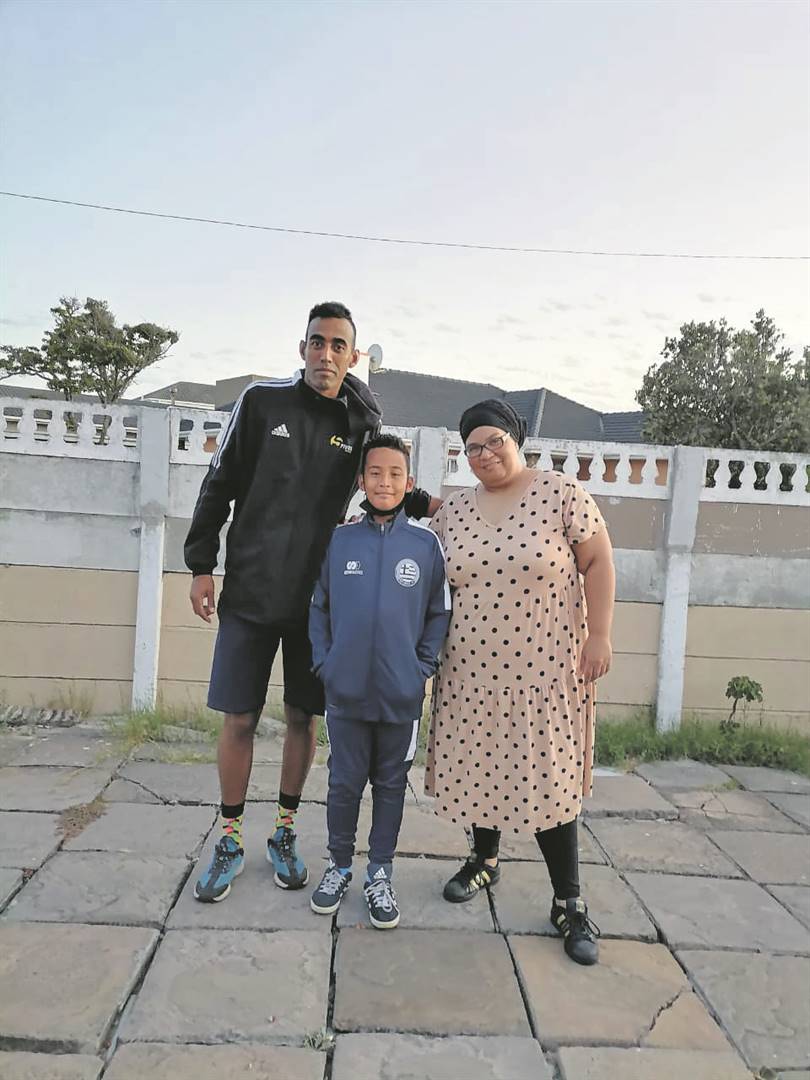 Abdul Muhaymin Mabara (11) with his parents. PHOTO: supplied