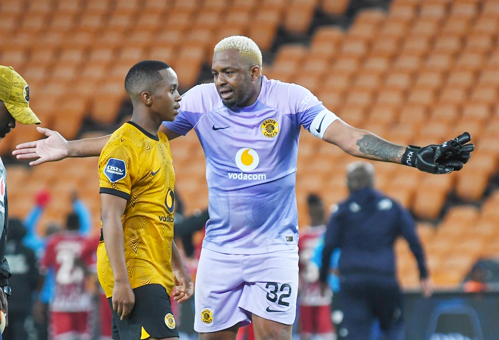 Itumeleng Khune speaks to Nkosingiphile Ngcobo of Kaizer Chiefs during the DStv Premiership match between Kaizer Chiefs and Sekhukhune United at FNB Stadium on January 07, 2023 in Johannesburg, South Africa.
