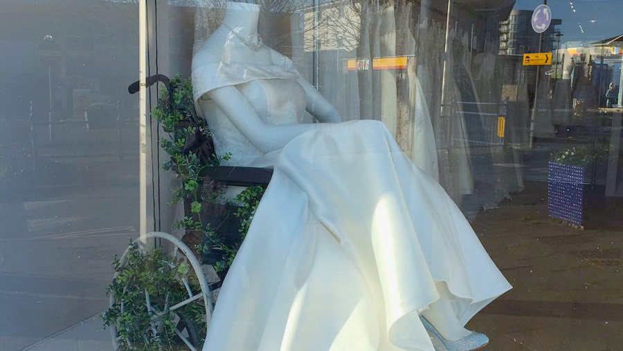 Bridal boutique displays a wheelchair-using mannequin