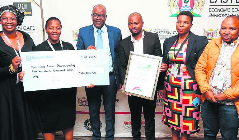 Umzimvubu Local Municipality officials receive the award from MEC Mlungisi Mvoko, third from left.                          