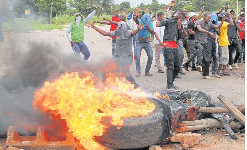 Protesters burned tyres and blocked roads in the Zimbabwean capital of Harare yesterday.Photo by Reuters