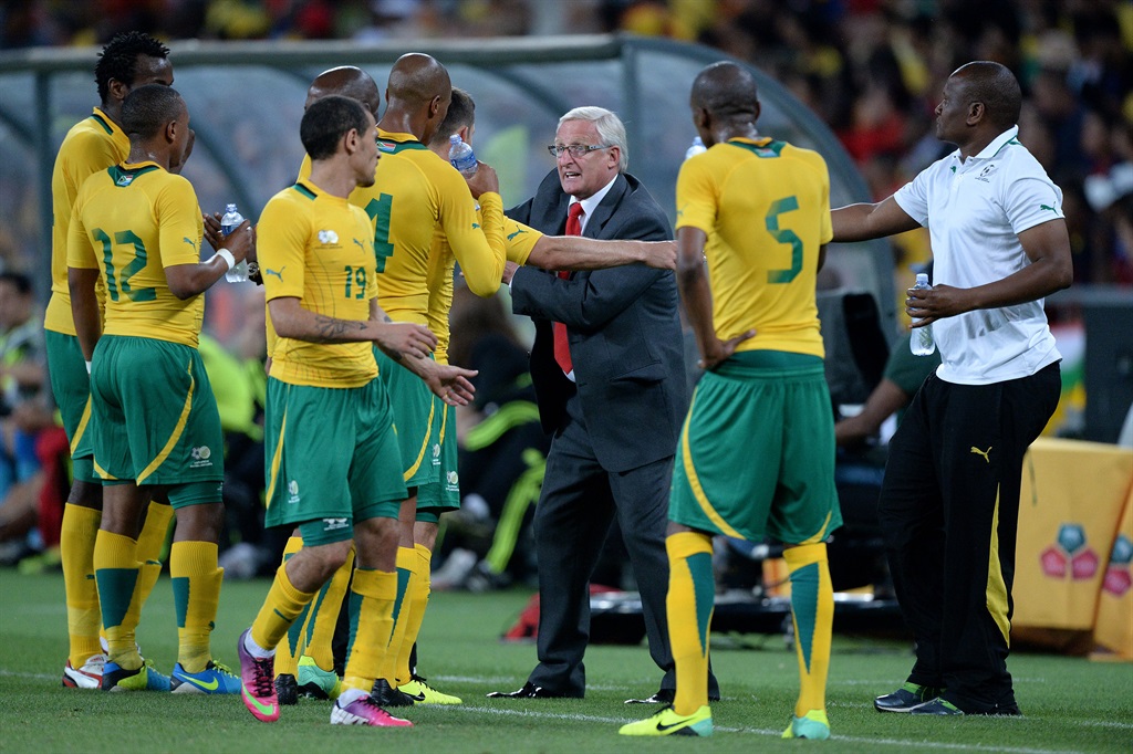 JOHANNESBURG, SOUTH AFRICA - NOVEMBER 19: Gordon Igesund of South Africa congratulates his players at the final whistle during the International friendly match between South Africa and Spain at Soccer City Stadium on November 19, 2013 in Johannesburg, South Africa.  (Photo by Duif du Toit/Gallo Images)