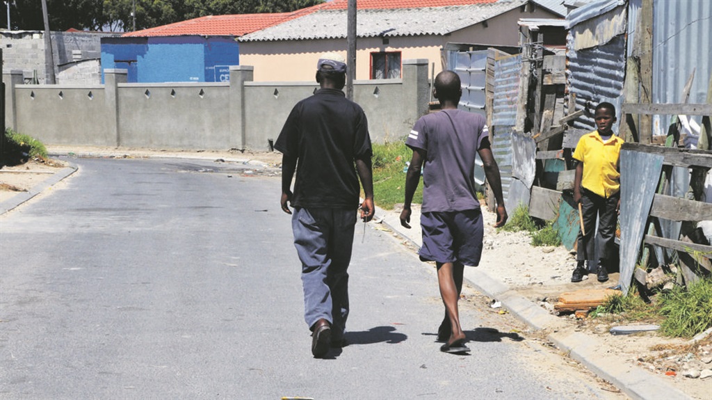 People can walk freely down the road after the drain was cleared. Photo by Lulekwa Mbadamane