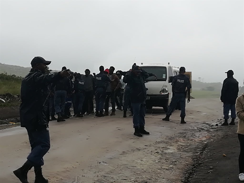 Police search members of community in Xolobeni for dangerous weapons. Picture: Lubabalo Ngcukana/City Press