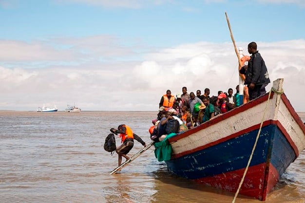 Survivors of Cyclone Idai arrive by rescue boat in Beira, Mozambique. (Photo -Denis Onyodi - Red Cross Red Crescent Climate Centre via AP)