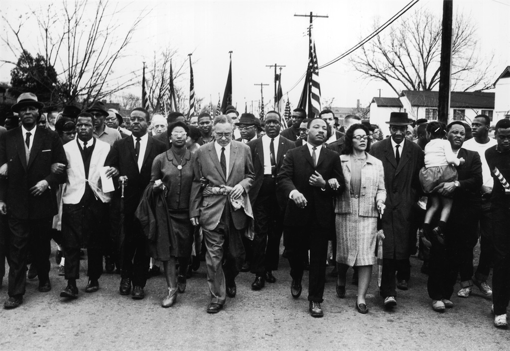 US civil rights campaigner Martin Luther King (1929 – 1968) and his wife Coretta Scott King lead a black voting rights march from Selma, Alabama, to the state capital in Montgomery on March 30 1965 Picture: William Lovelace / Express / Getty Images 