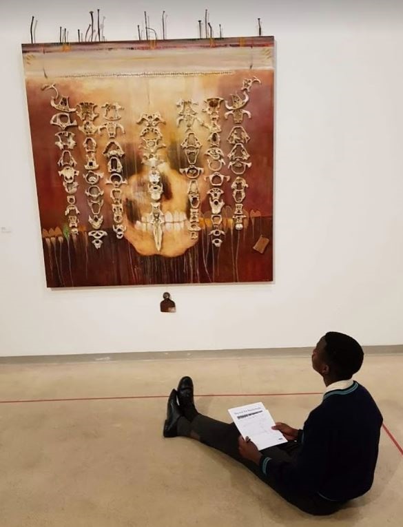 A student exercises her powers of observation. Photo be Wits Art Museum