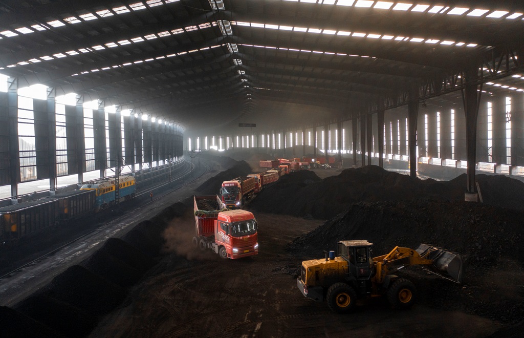 Transport vehicles load and unload coal at State energy Group Shendong Coals Bultai coal mine in Yjin Horo Banner, in Ordos city, Inner Mongolia, China, January 14, 2023. 