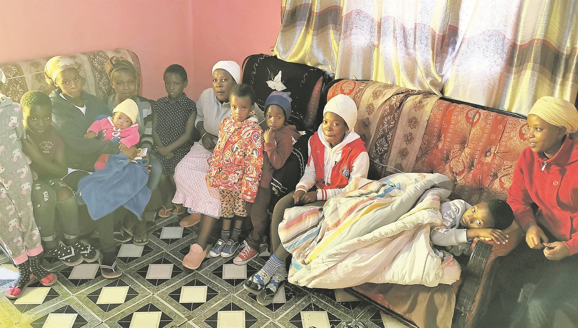 Nosapho Dukada with her children and grandchildren at their home in Newrest in Qokolweni village near Mthatha PHOTO: Lubabalo Ngcukana