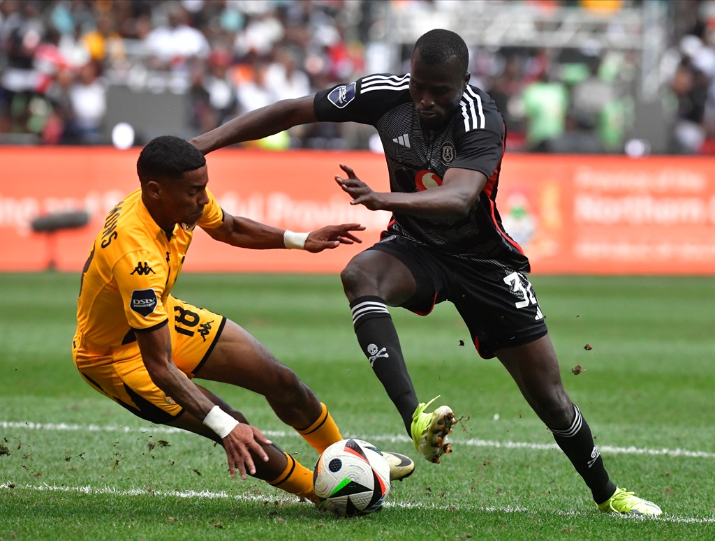 JOHANNESBURG, SOUTH AFRICA - MARCH 09: Dillan Solomons of Kaizer Chiefs and Souaibou Marou of Orlando Pirates during the DStv Premiership match between Orlando Pirates and Kaizer Chiefs at FNB Stadium on March 09, 2024 in Johannesburg, South Africa 