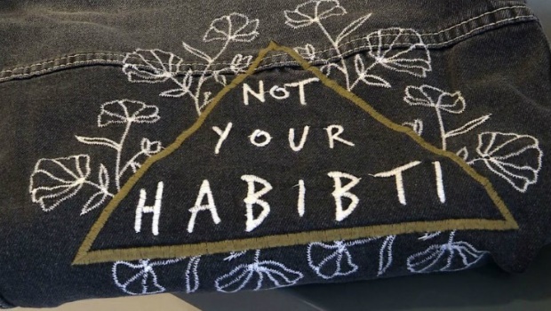 "Not your habibti" embroidered on a denim jacket
