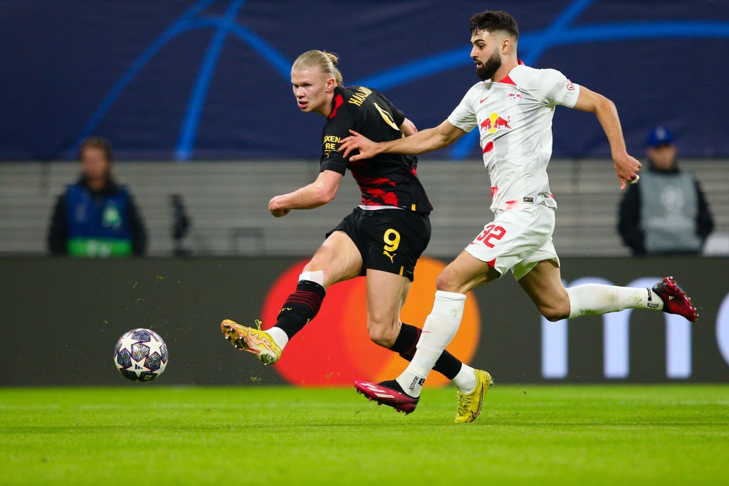LEIPZIG, GERMANY - FEBRUARY 22: Erling Haaland of Manchester City shoots under pressure from Josko Gvardiol of RB Leipzig during the UEFA Champions League round of 16 leg one match between RB Leipzig and Manchester City at Red Bull Arena on February 22, 2023 in Leipzig, Germany. (Photo by Craig Mercer/MB Media/Getty Images)