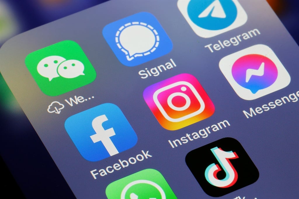 In this photo illustration, the logos of social media applications, Instagram, WhatsApp, Messenger, WeChat, Signal, Telegram, TikTok, Twitter and Facebook are displayed on the screen of an iPhone. (Photo illustration by Chesnot/Getty Images)