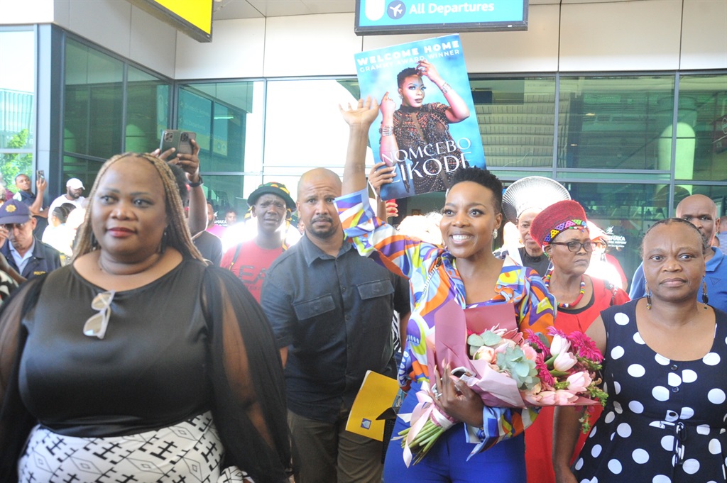  
Nomcebo Zikode arriving at King Shaka airport welcomed by eThekwini Chief Whip Patience Sishange, DJ sox and many more. Photo by Jabulani Langa
