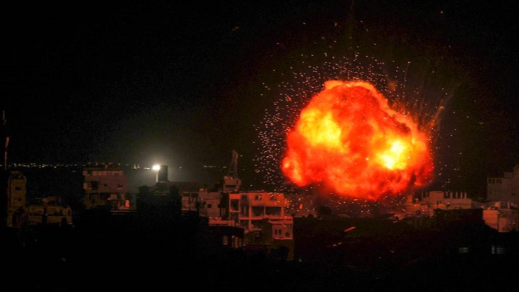 A fireball erupts during Israeli bombardment on Ra