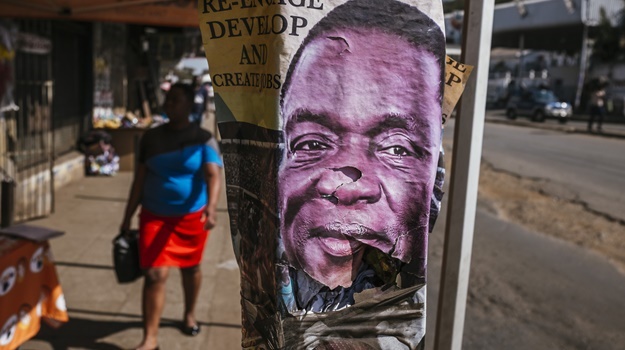 An election poster for Emmerson Mnangagwa. (Photographer: Waldo Swiegers/Bloomberg)