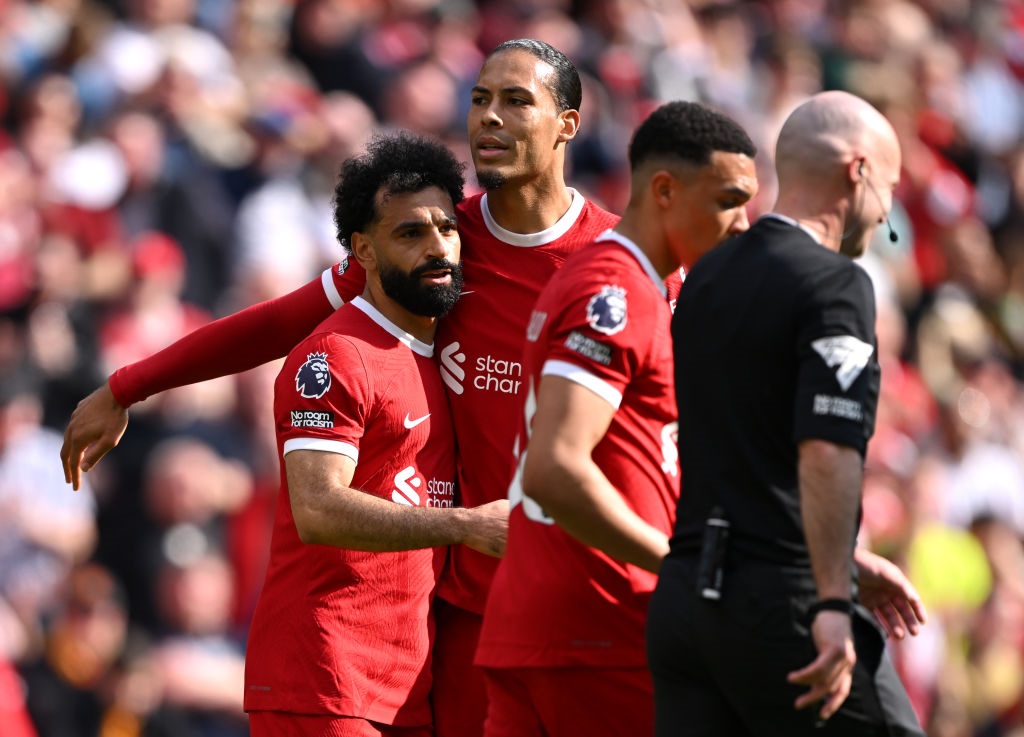 LIVERPOOL, ENGLAND - MAY 05: Mohamed Salah of Liverpool celebrates scoring his teams first goal with teammate Virgil van Dijk during the Premier League match between Liverpool FC and Tottenham Hotspur at Anfield on May 05, 2024 in Liverpool, England. (Photo by Stu Forster/Getty Images)
