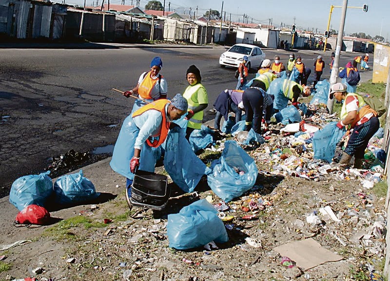 Beneficiaries of the expanded public works programme at work in Khayelitsha, Cape Town. The programme provides temporary paid work opportunities. Picture: Mandla Mnyakama