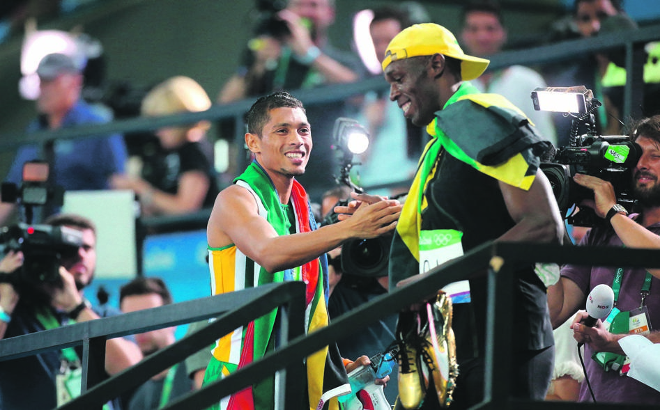 passing the baton Wayde van Niekerk interacts with Usain Bolt on the night the South African champion smashed the 400m world record at the 2016 Olympic GamesPHOTO: Jean Catuffe / Getty Images