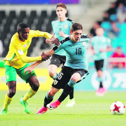 triumph Federico Valverde of Uruguay and South Africa’s Teboho Mokoena at the Under-20 World Cup in Korea in 2017. South Africa’s Under-20 team has qualified for the CAF Under-20 Nations Cup finals in Niger, which may create a financial headache for Safa PHOTO: fIFA via Getty Images