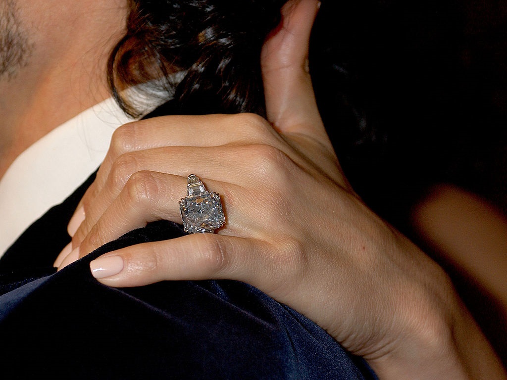 Jennifer Lopez's hand with a big rock on her ex-husband's (Marc Anthony) shoulder in 2006.