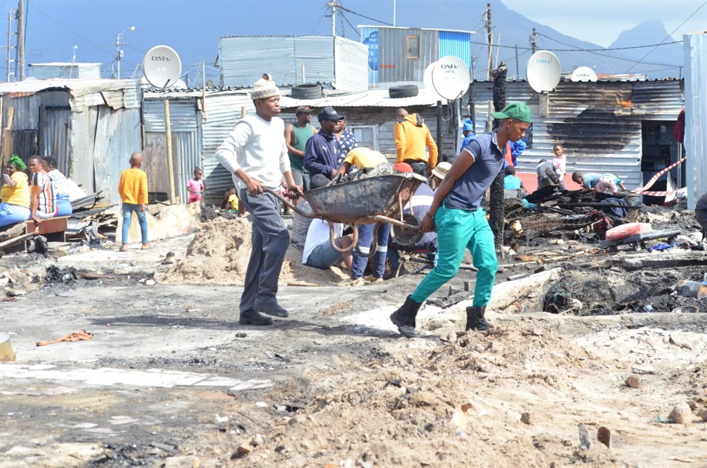 Several shacks were destroyed in a fire in Mfuleni in Cape Town on Sunday morning. Photos by Lulekwa Mbadamane