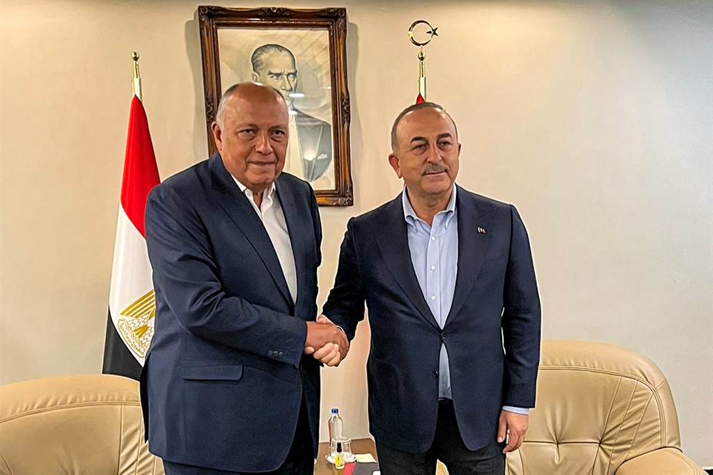 This handout picture released by the Egyptian Foreign Ministry shows Egypt's Foreign Minister Sameh Shoukri (L) meeting with his Turkish counterpart Mevlut Cavusoglu in Adana in central southern Turkey on 27 February, 2023.